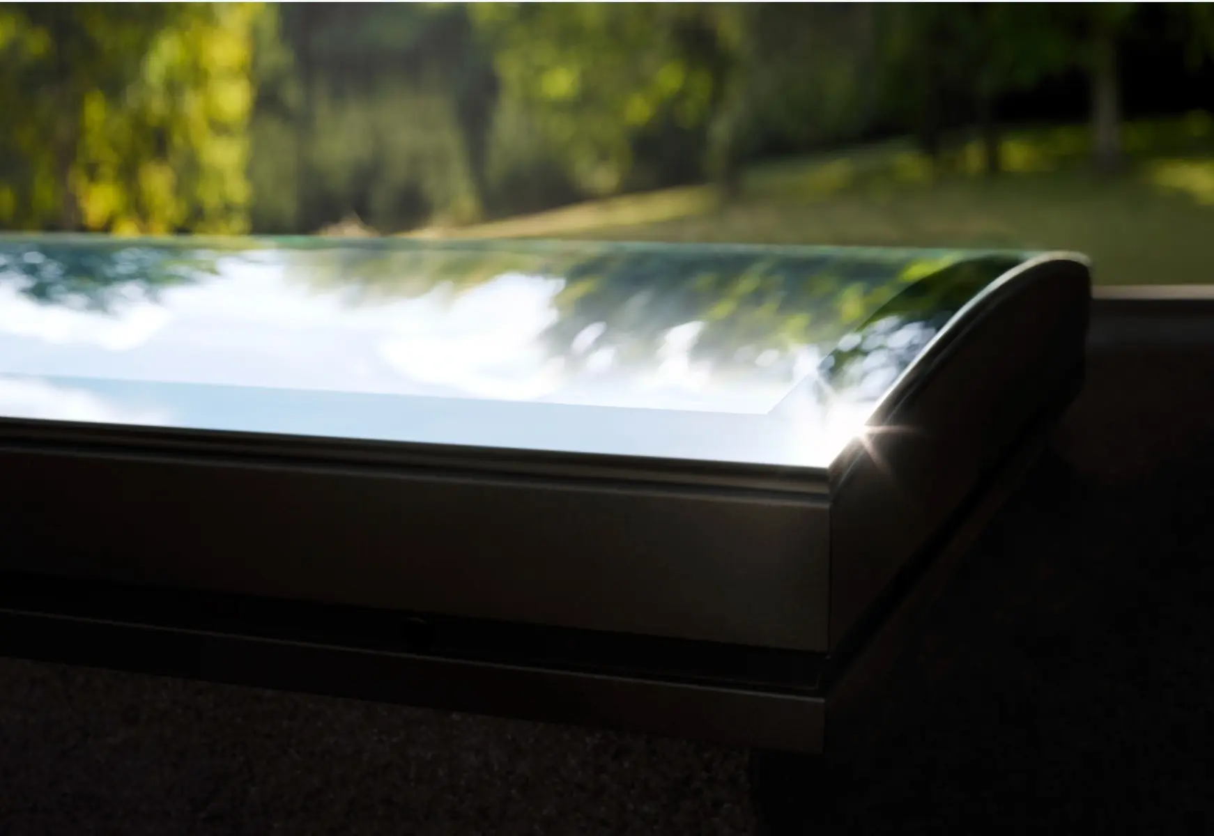 Velux platdakraam gebogen glas